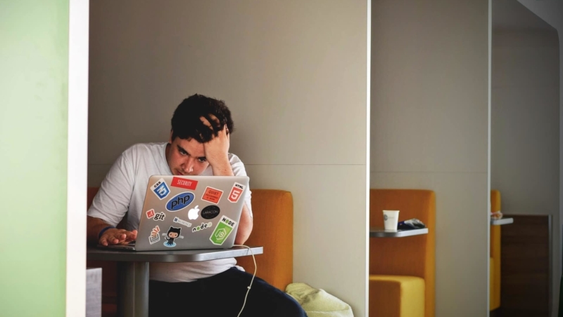 photo of man on laptop frustrated over making website mistakes