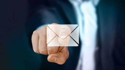 photo of man pushing email icon, increase email open rates