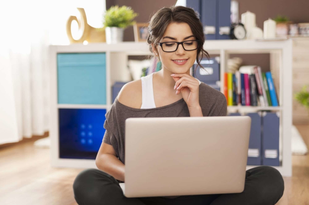 photo of woman with laptop learning about websites for bloggers