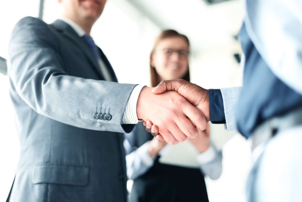 photo of corporate business people shaking hands