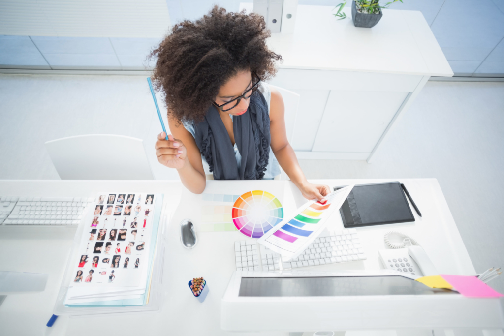 photo of designer looking at color palette at desk
