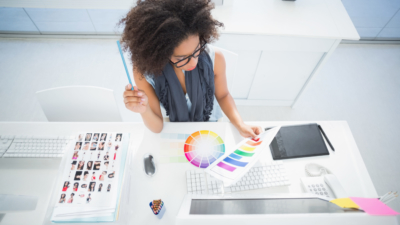 photo of designer looking at color palette at desk