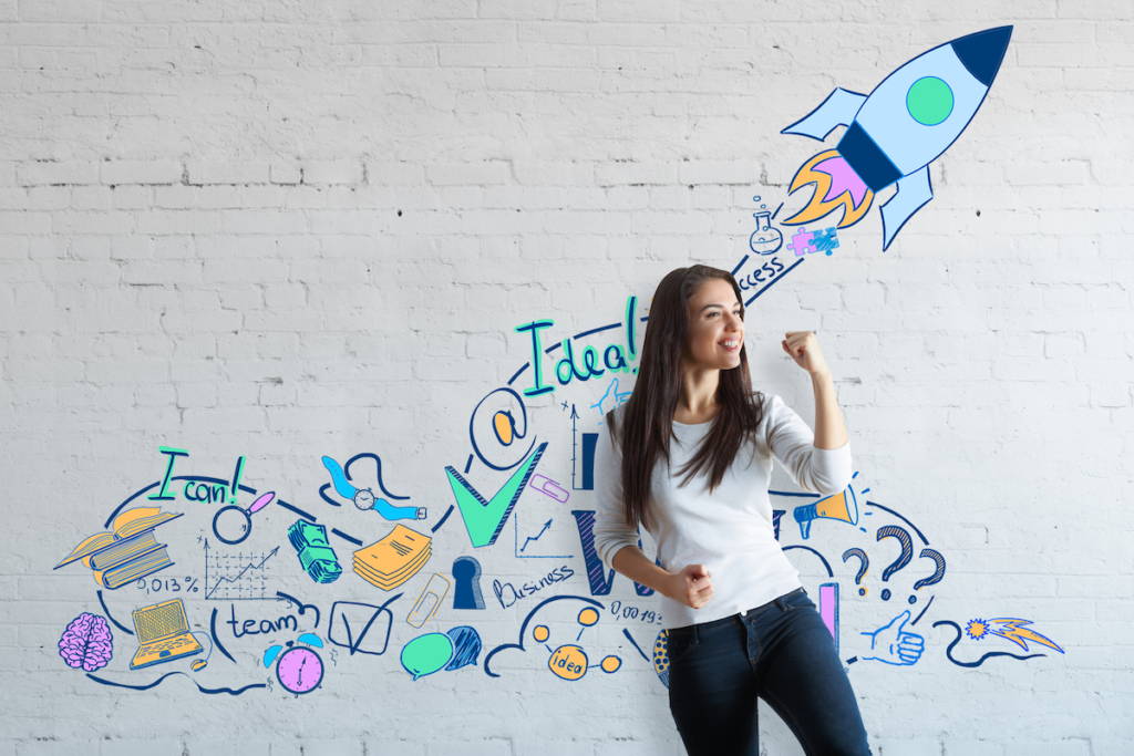 Photo of woman and drawing of rocket on wall, website launch concept