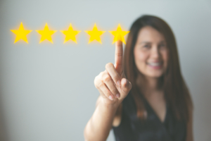 testimonials and reviews concept, person selecting 5 stars