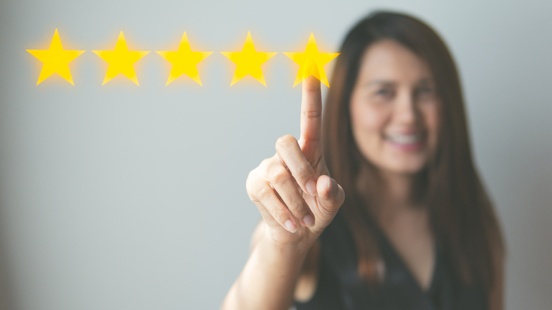 Woman giving 5 star rating