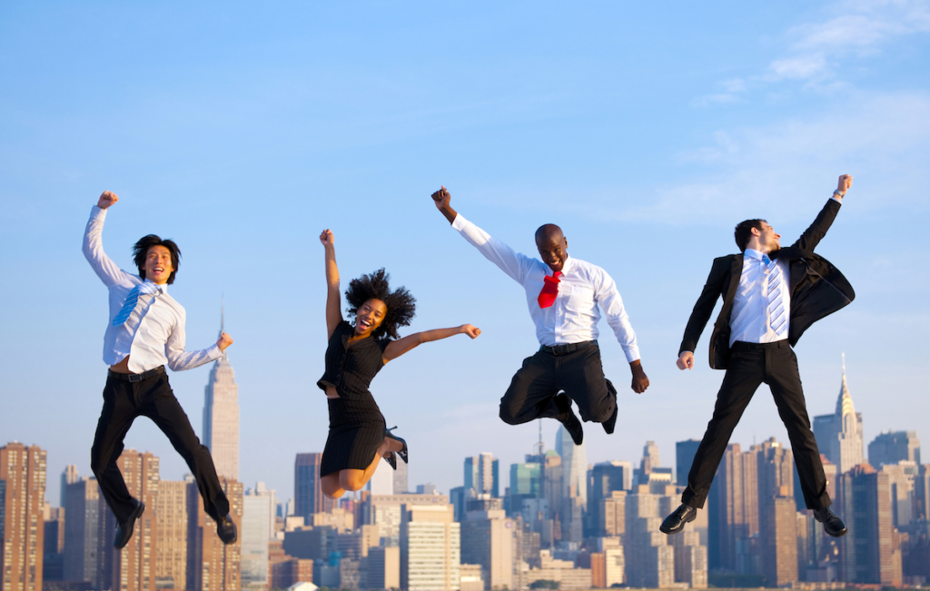 Happy Successful Business People Celebrating And Jumping In New York