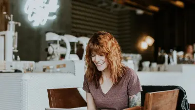 photo of girl on laptop using her website as a marketing tool