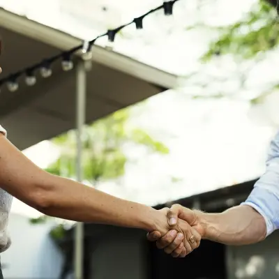 photo of people shaking hands, becoming affiliates