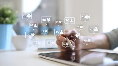 photo of person using tablet with social media likes and shares popping up over the screen