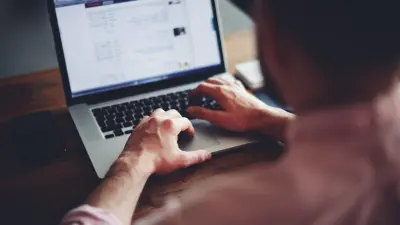 person blogging on laptop