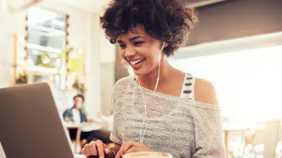 Photo of young woman working on content writing for website