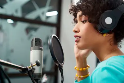 image of woman recording with a microphone