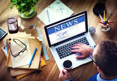 image of news website on laptop