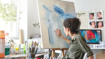 artist painting in studio