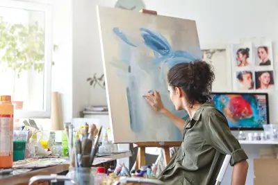 artist painting in studio