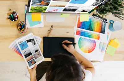 Woman creating online portfolio on computer