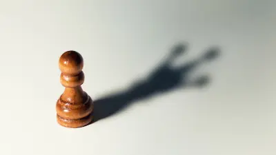 trust yourself, self confidence concept - chess pawn with king shadow