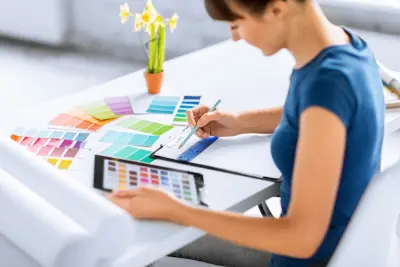 interior design, renovation and technology concept - woman working with color samples for selection