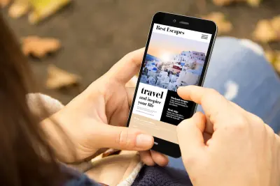 person looking at travel blog on a cell phone