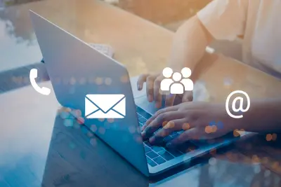 contact and support icons overlaid on person typing on laptop