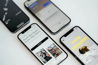 three different cell phones sitting next to each other representing responsive design