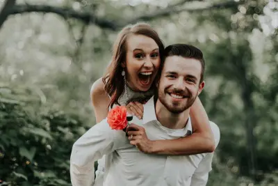 happy just married couple looking at camera smiling