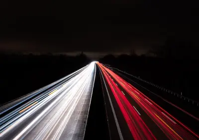 time lapse photography of cars on road during night time; minimal website concept
