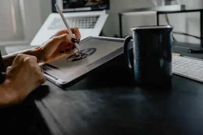 person doing art on a tablet