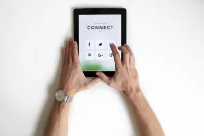 person using iPad, clicking on social media icon on screen that says Connect
