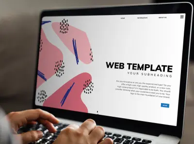 person working on a minimal web template on the laptop

